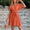 Fashion Solid Color V-Neck Tie-Up Waist Pleated Dress Wholesale Dresses SDN539989